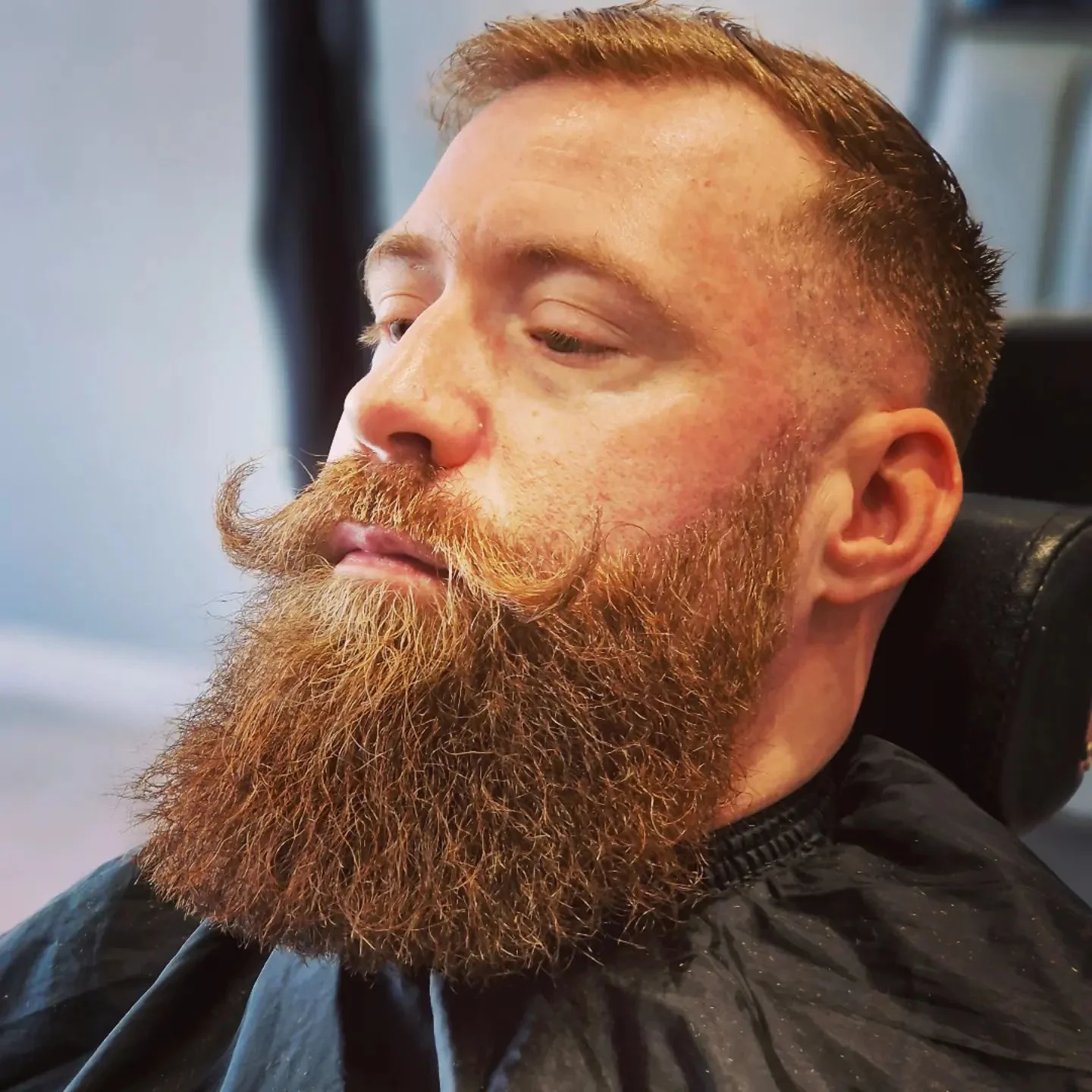 Full groomed beard with curled moustache